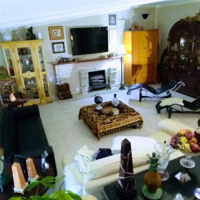 living area featuring a stone fireplace