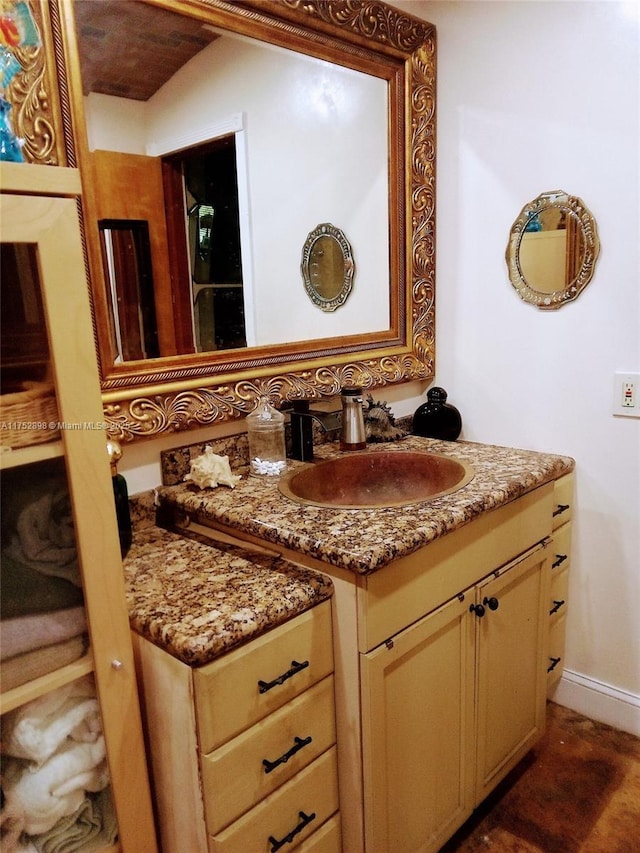 bathroom featuring vanity and baseboards