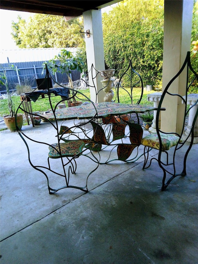 balcony featuring a patio area and outdoor dining area