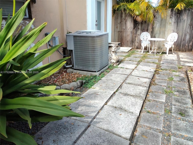 exterior details with cooling unit and fence