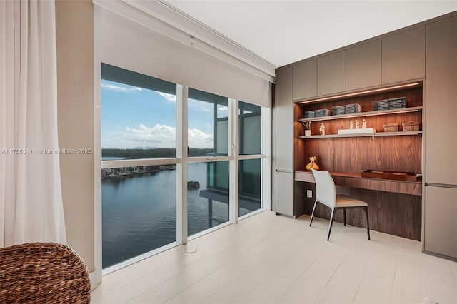 office area with a water view and built in desk