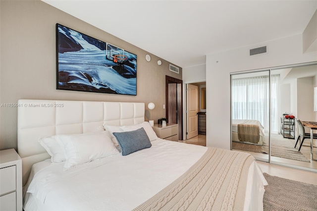 bedroom featuring visible vents and a closet