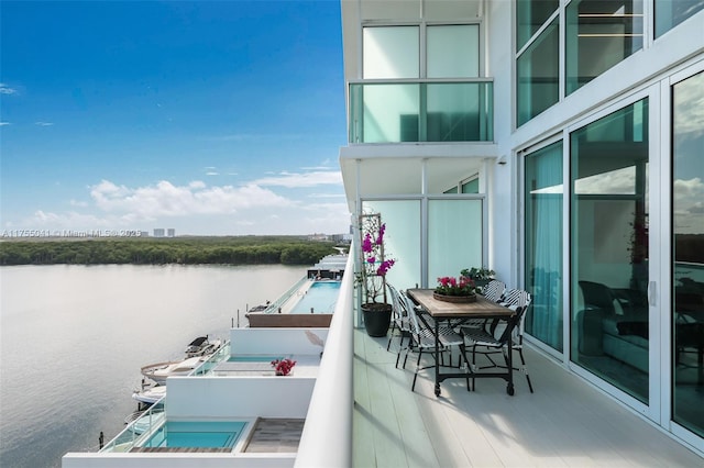 balcony featuring a water view