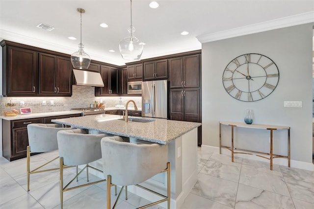 kitchen featuring visible vents, marble finish floor, stainless steel appliances, under cabinet range hood, and a sink
