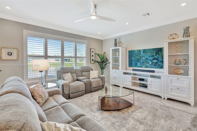 living room featuring visible vents, crown molding, and ceiling fan