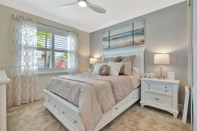 bedroom featuring a ceiling fan, light carpet, and baseboards