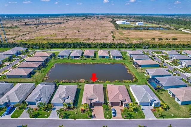 aerial view featuring a water view and a residential view