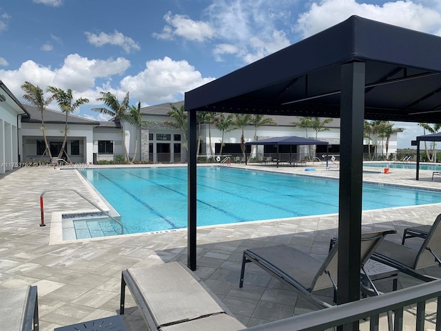 community pool with a patio