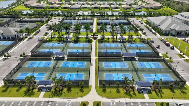 drone / aerial view featuring a residential view and a water view