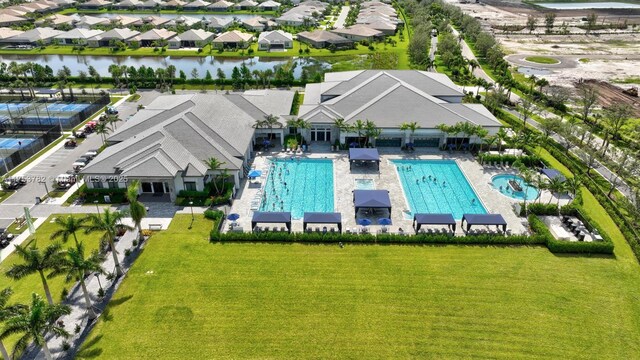 aerial view with a water view and a residential view