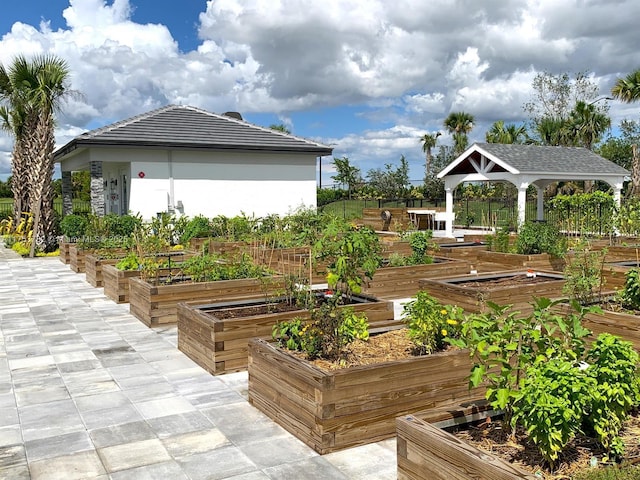 exterior space with a vegetable garden and a gazebo