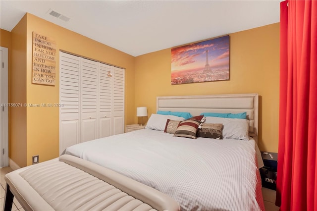 bedroom with a closet and visible vents