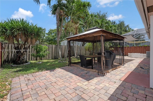 view of patio with a gazebo and a fenced backyard