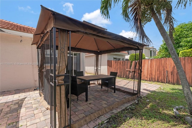 view of patio / terrace featuring fence and a gazebo