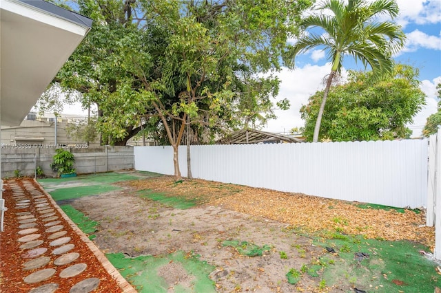 view of yard with a fenced backyard