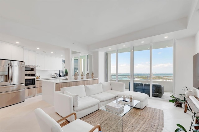 living room with recessed lighting and expansive windows