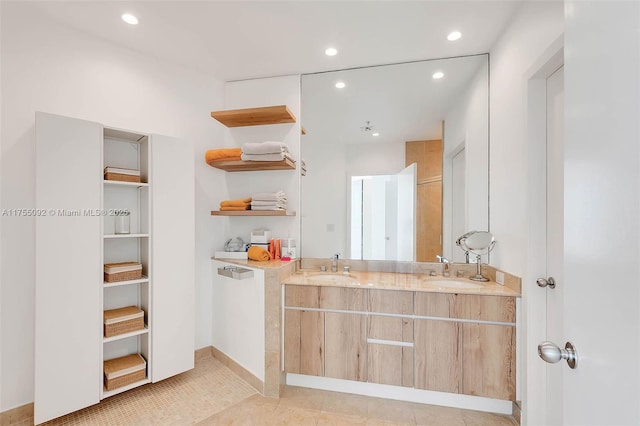 kitchen featuring open shelves, recessed lighting, light countertops, light brown cabinetry, and a sink