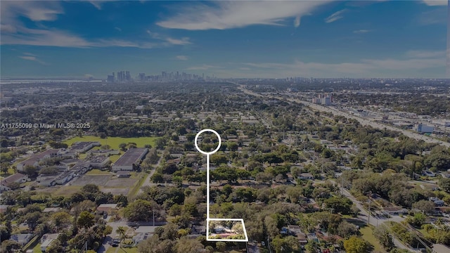 birds eye view of property with a view of city