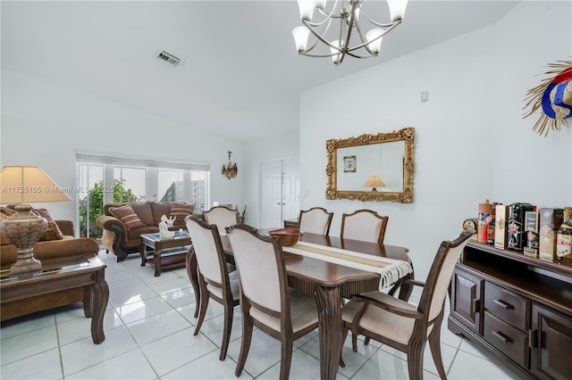 dining area featuring lofted ceiling, light tile patterned floors, visible vents, and an inviting chandelier