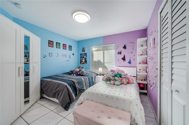 bedroom featuring light tile patterned floors