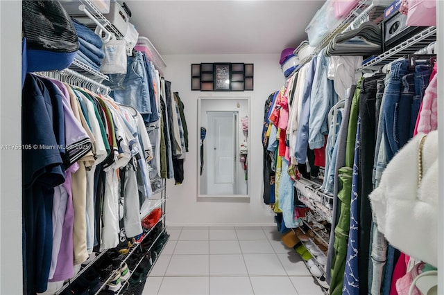 spacious closet featuring tile patterned floors