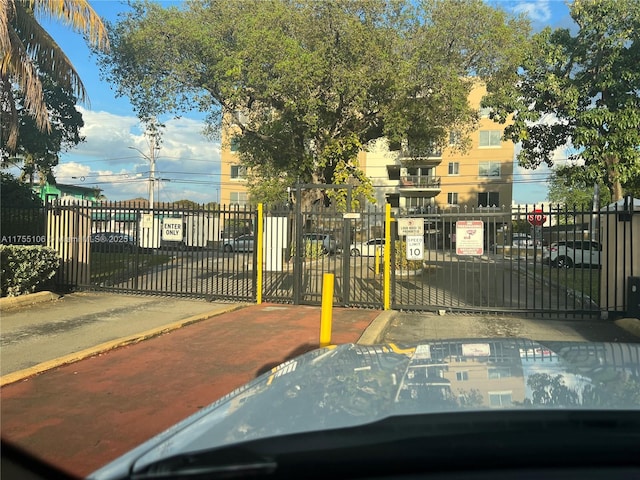 view of gate featuring fence