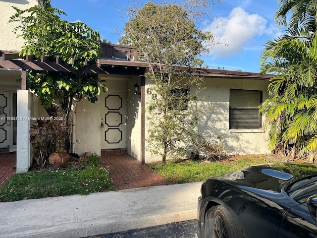 exterior space with stucco siding