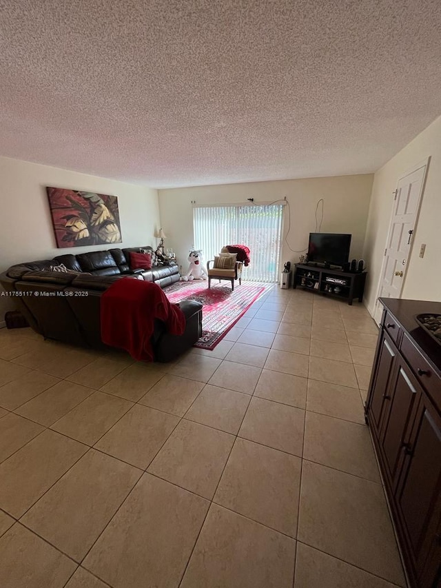 living area with light tile patterned floors and a textured ceiling