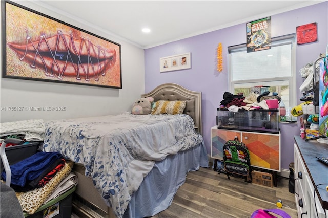 bedroom featuring recessed lighting, crown molding, and wood finished floors