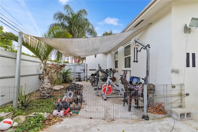 view of patio featuring fence