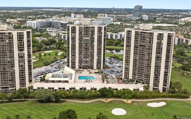 bird's eye view featuring a city view and golf course view