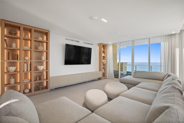 living room featuring expansive windows and light colored carpet