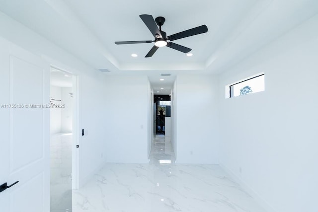 spare room featuring ceiling fan, recessed lighting, visible vents, marble finish floor, and a raised ceiling