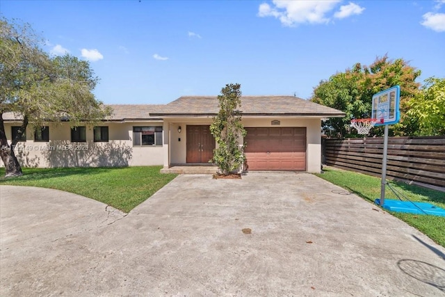 single story home with stucco siding, concrete driveway, an attached garage, fence, and a front lawn