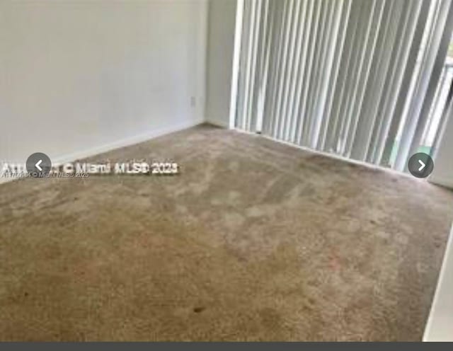 empty room featuring carpet flooring