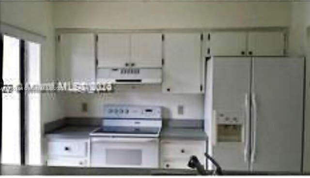 kitchen featuring white range with electric stovetop, fridge with ice dispenser, and exhaust hood