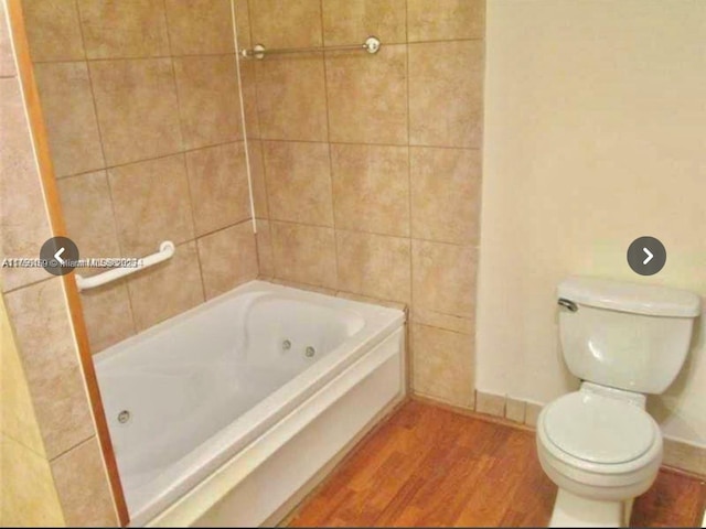 full bathroom featuring toilet and wood finished floors