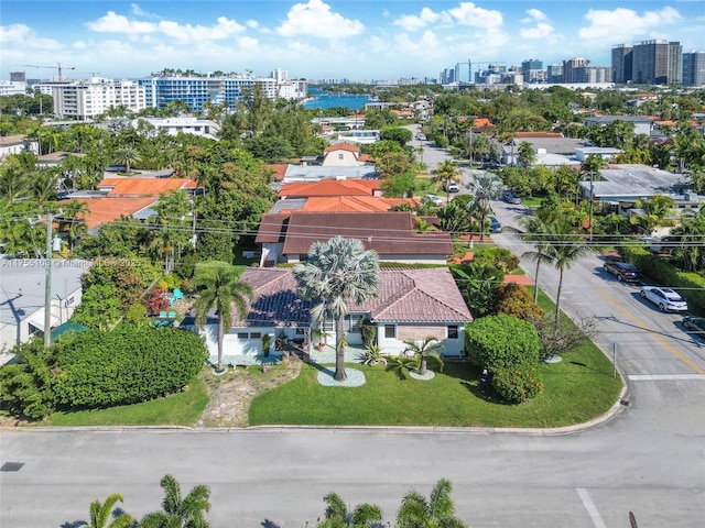 drone / aerial view featuring a water view and a city view