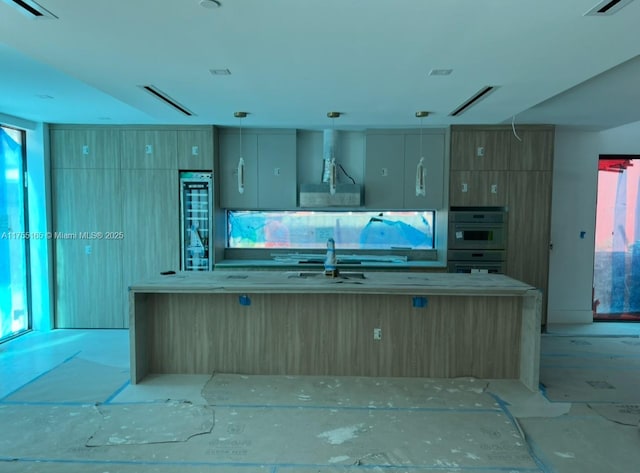 kitchen with double wall oven, extractor fan, visible vents, and pendant lighting