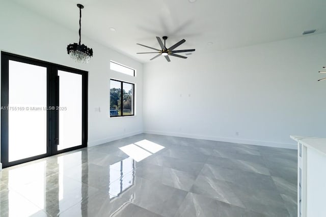 empty room with french doors, visible vents, marble finish floor, and baseboards