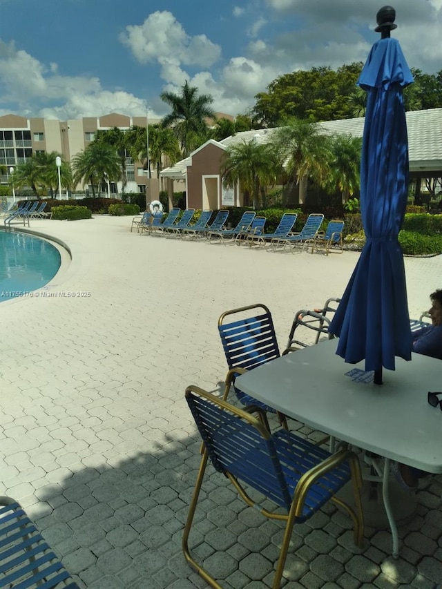 exterior space featuring a patio area and a swimming pool