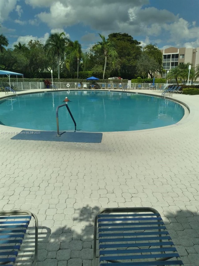 community pool with fence