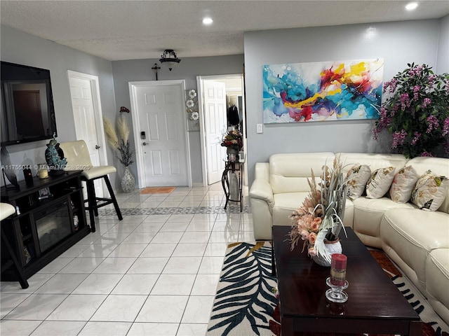 living room featuring recessed lighting, a textured ceiling, and light tile patterned floors