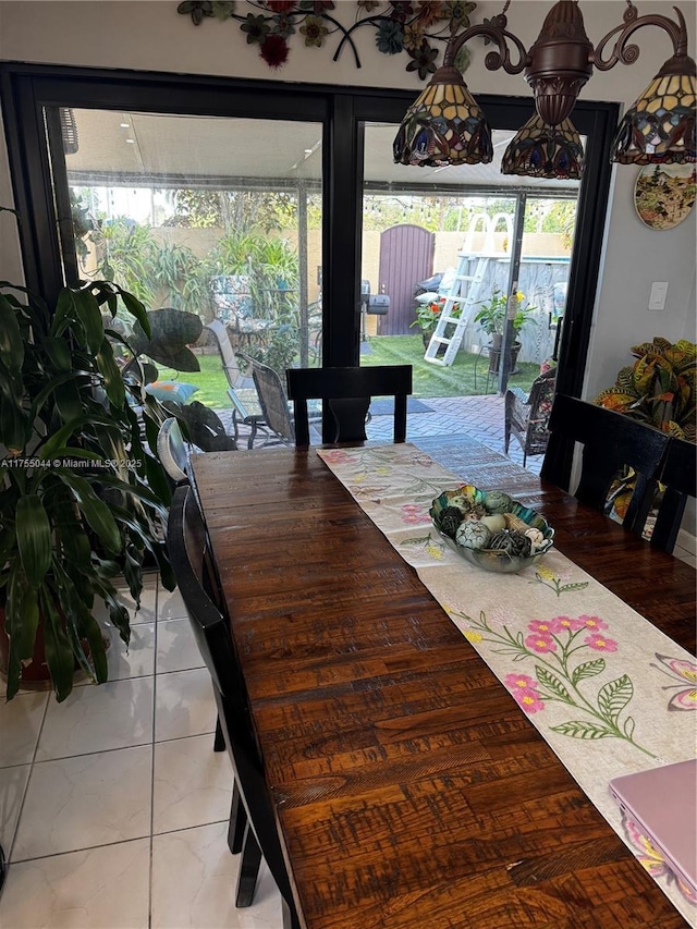 dining space featuring tile patterned floors