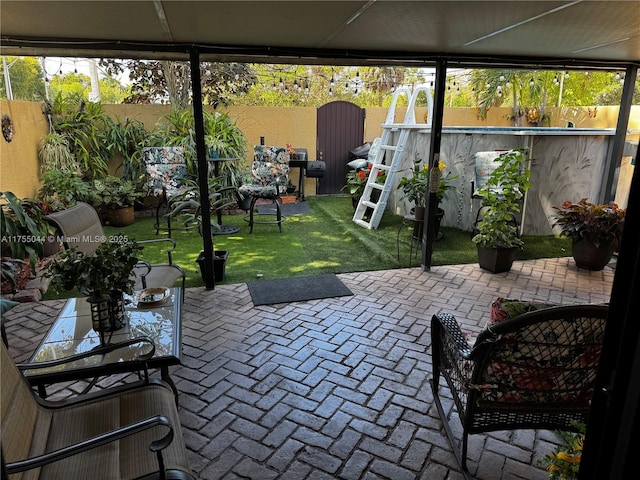 view of patio with outdoor dining area and a fenced backyard