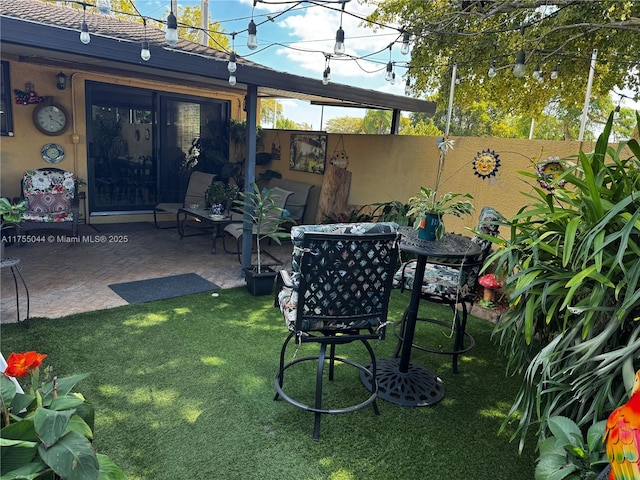 view of yard featuring a patio and fence