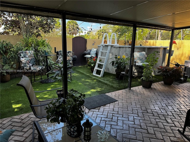 view of patio with a fenced backyard and an outdoor pool