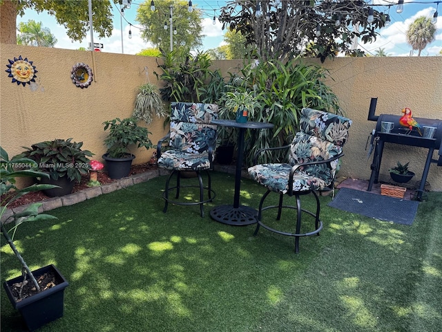 view of yard with a fenced backyard