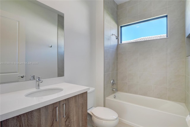 full bath featuring toilet, vanity, and shower / tub combination