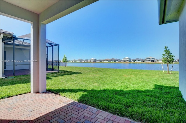 5007 Ofanto Ln, Ave Maria, FL 34142 - view of yard featuring a water view, a patio area, a residential view, and a lanai